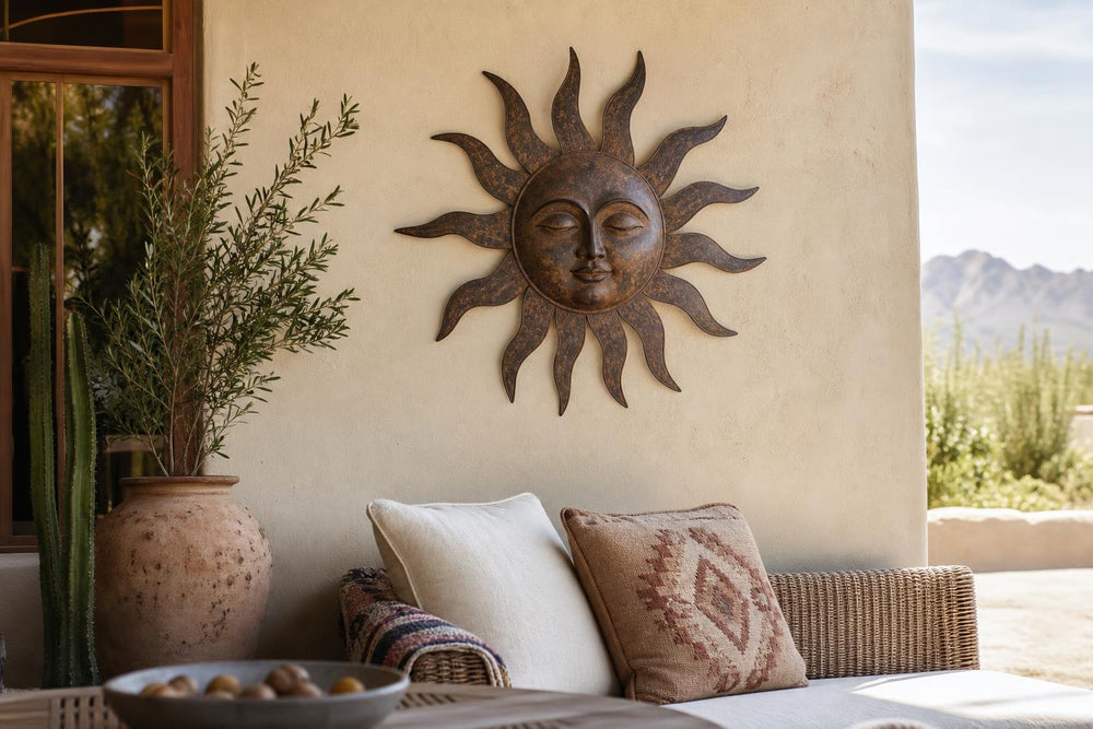 Generic rustic sun-face metal wall hanging styled on a patio wall