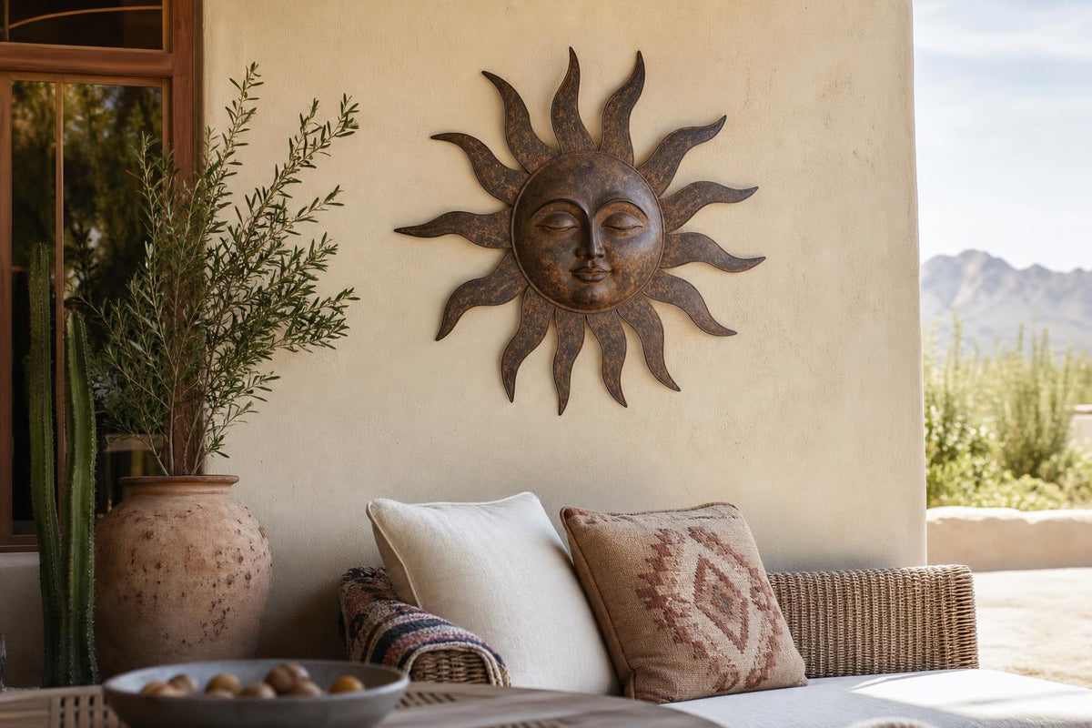 Generic rustic sun-face metal wall hanging styled on a patio wall