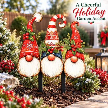 Christmas gnome yard art displayed in a snowy garden bed